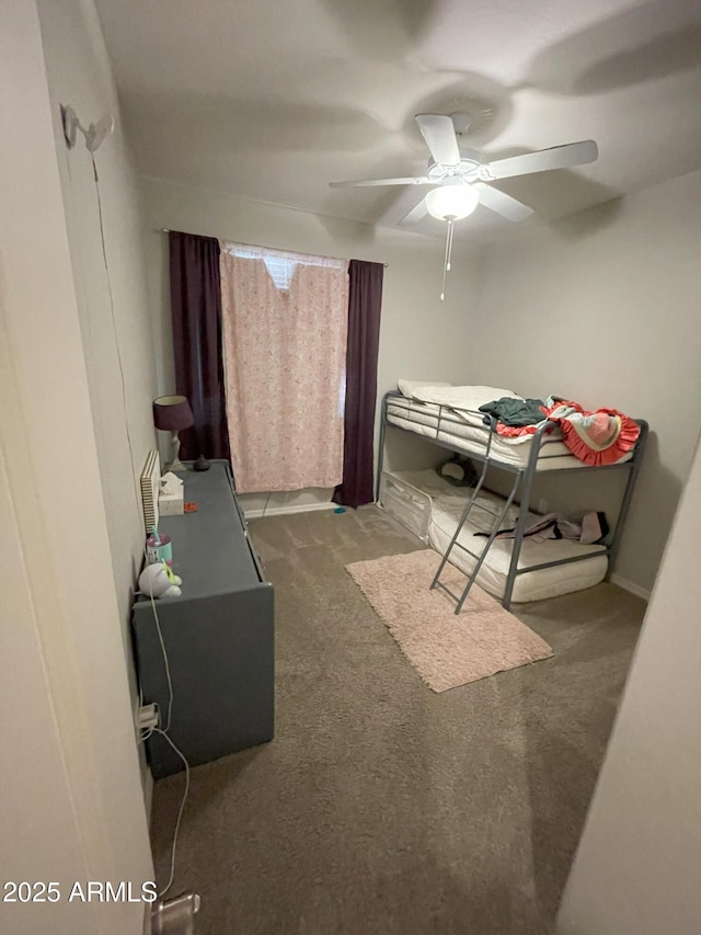 carpeted bedroom with a ceiling fan