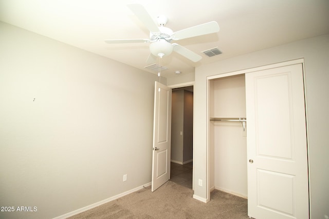 20471 E Carriage Way, Queen Creek, AZ 85142 - unfurnished bedroom with light colored carpet, baseboards, a closet, and ceiling fan