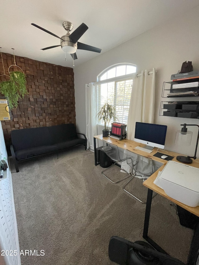 office featuring a ceiling fan and carpet