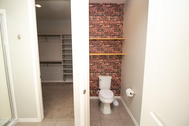 20471 E Carriage Way, Queen Creek, AZ 85142 - bathroom featuring toilet, tile patterned flooring, a spacious closet, and baseboards