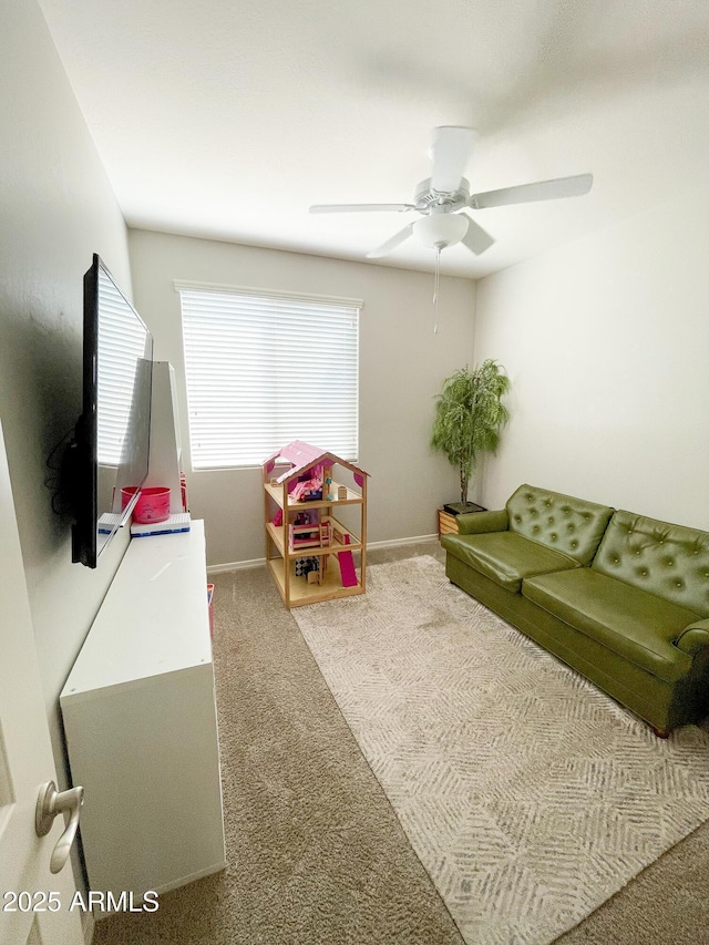 playroom with carpet flooring, baseboards, and ceiling fan