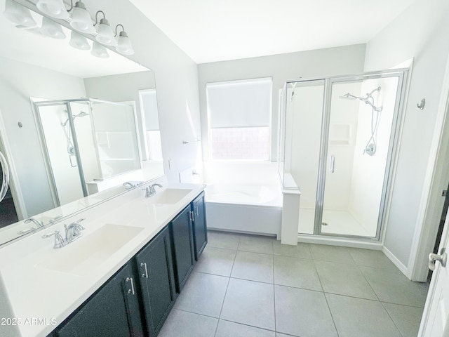 full bath with tile patterned flooring, a stall shower, and a sink