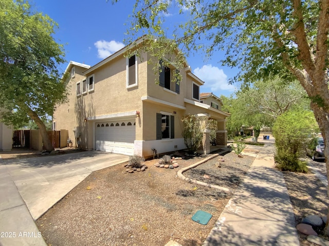 4229 E Betsy Ln, Gilbert, AZ 85296 - view of front facade with an attached garage, stucco siding, and driveway