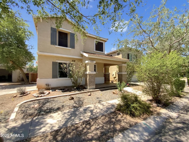 4229 E Betsy Ln, Gilbert, AZ 85296 - view of front of house featuring covered porch, stucco siding, and brick siding