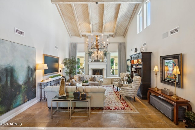 living room featuring a notable chandelier, beam ceiling, wood ceiling, and a high ceiling