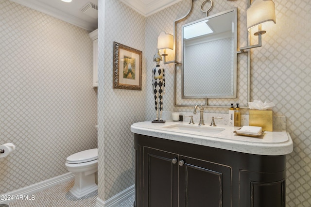 bathroom with tile patterned flooring, vanity, toilet, and ornamental molding