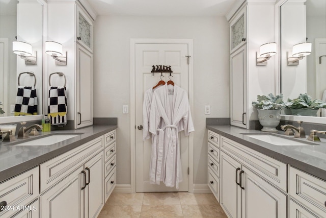 bathroom with tile patterned flooring and vanity