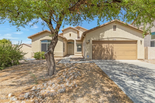 view of front of property with a garage