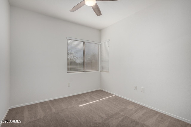 empty room featuring ceiling fan and carpet flooring