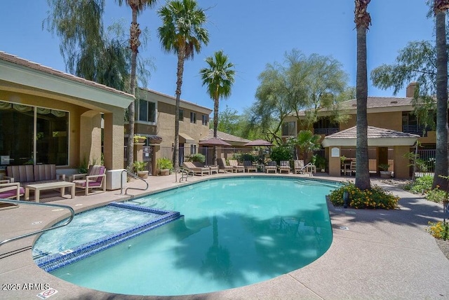 view of swimming pool featuring a patio area