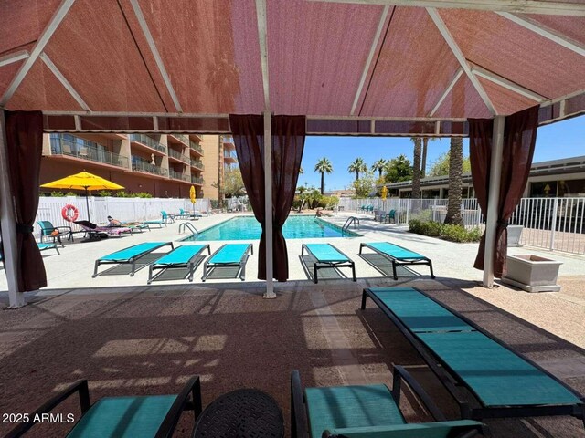 4750 N Central Ave Unit R3, Phoenix, AZ 85012 - community pool featuring a patio and fence