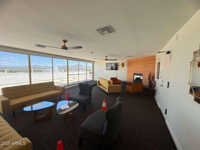 4750 N Central Ave Unit R3, Phoenix, AZ 85012 - carpeted living area featuring a ceiling fan and baseboards