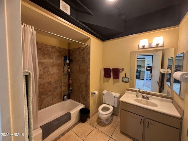 4750 N Central Ave Unit R3, Phoenix, AZ 85012 - bathroom with tile patterned floors, shower / bath combo with shower curtain, toilet, and vanity