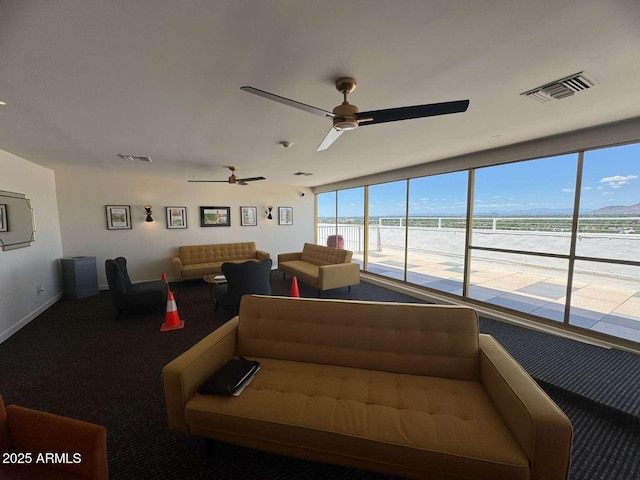 4750 N Central Ave Unit R3, Phoenix, AZ 85012 - living room featuring carpet floors, ceiling fan, and baseboards