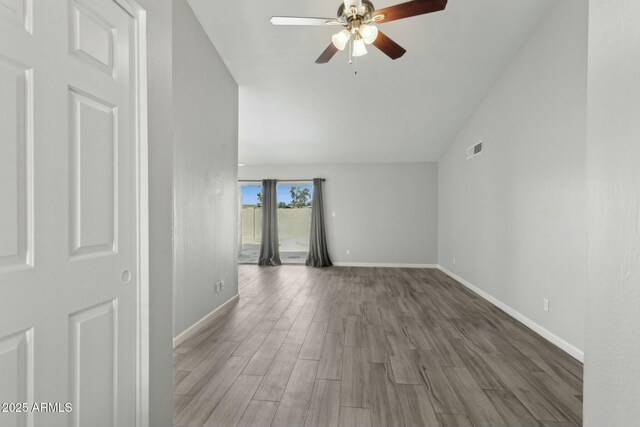 4634 W Aire Libre Ave, Glendale, AZ 85306 - spare room with visible vents, ceiling fan, baseboards, lofted ceiling, and wood finished floors
