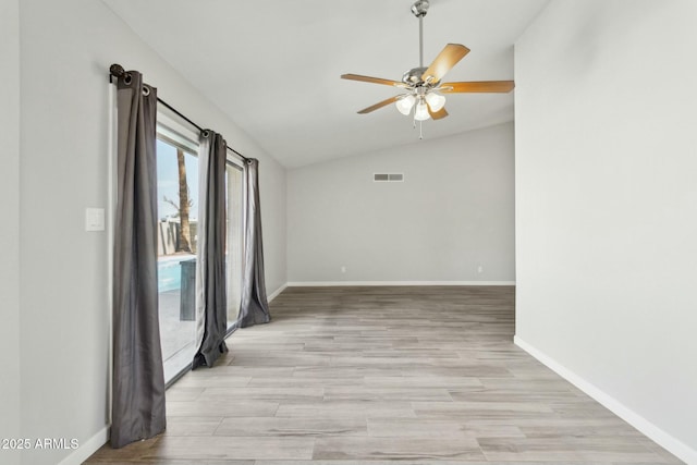 4634 W Aire Libre Ave, Glendale, AZ 85306 - spare room featuring visible vents, a ceiling fan, light wood-style floors, baseboards, and vaulted ceiling