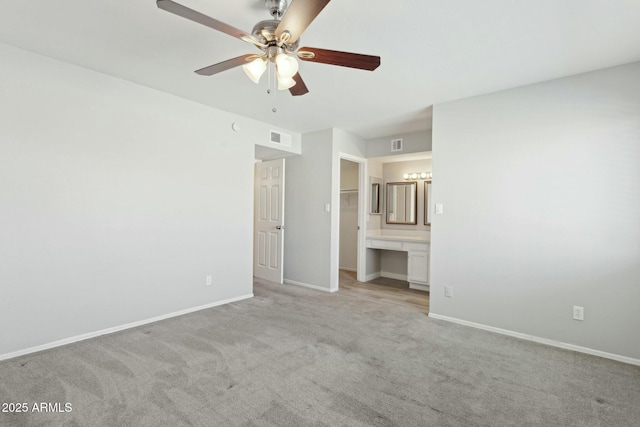 4634 W Aire Libre Ave, Glendale, AZ 85306 - unfurnished bedroom featuring light carpet, visible vents, a spacious closet, and baseboards