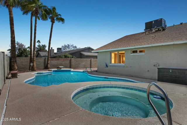4634 W Aire Libre Ave, Glendale, AZ 85306 - view of pool with a patio, a fenced backyard, cooling unit, a fenced in pool, and an in ground hot tub