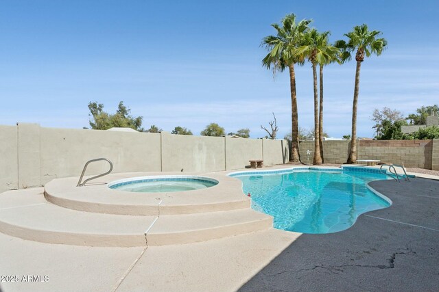 4634 W Aire Libre Ave, Glendale, AZ 85306 - view of swimming pool with an in ground hot tub, a fenced in pool, and a fenced backyard