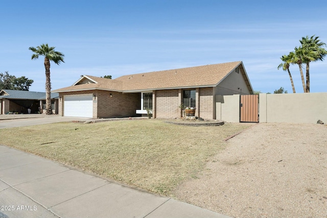 4634 W Aire Libre Ave, Glendale, AZ 85306 - single story home featuring a gate, brick siding, a garage, and driveway