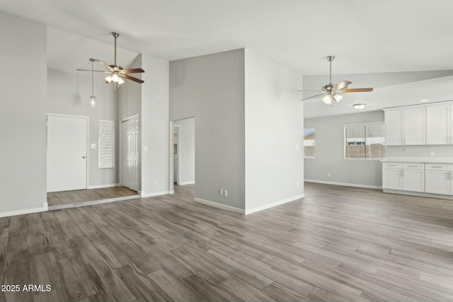 4634 W Aire Libre Ave, Glendale, AZ 85306 - unfurnished living room featuring wood finished floors, baseboards, and ceiling fan