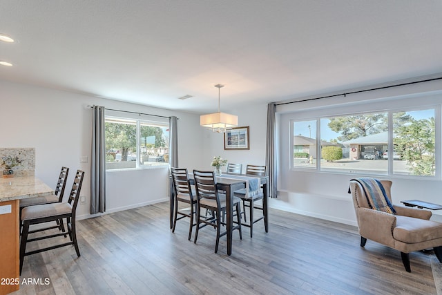 dining area featuring hardwood / wood-style flooring