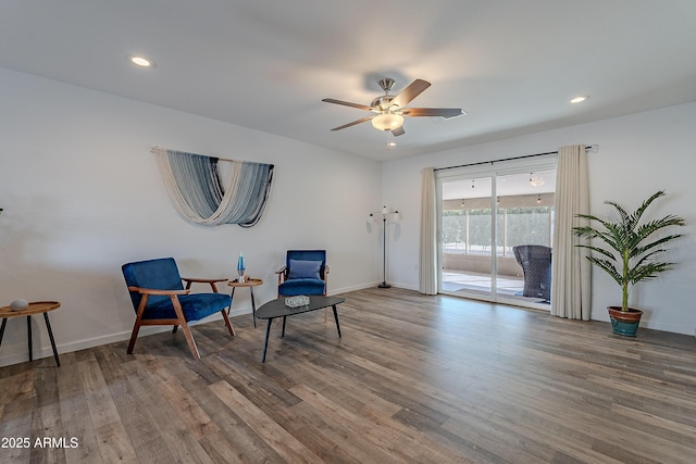 sitting room featuring ceiling fan and hardwood / wood-style flooring