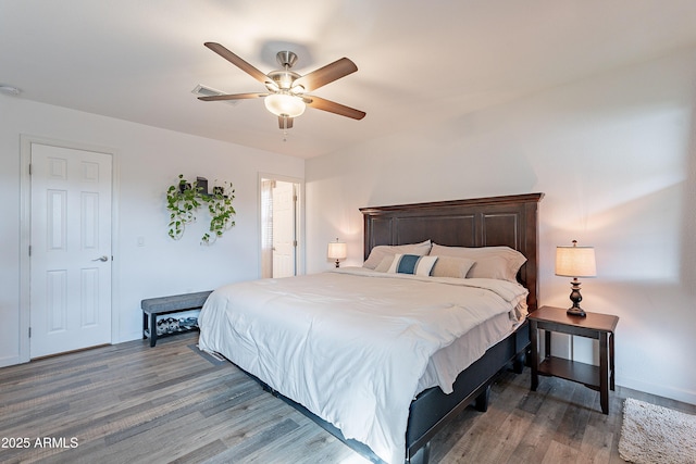 bedroom featuring ceiling fan and hardwood / wood-style flooring