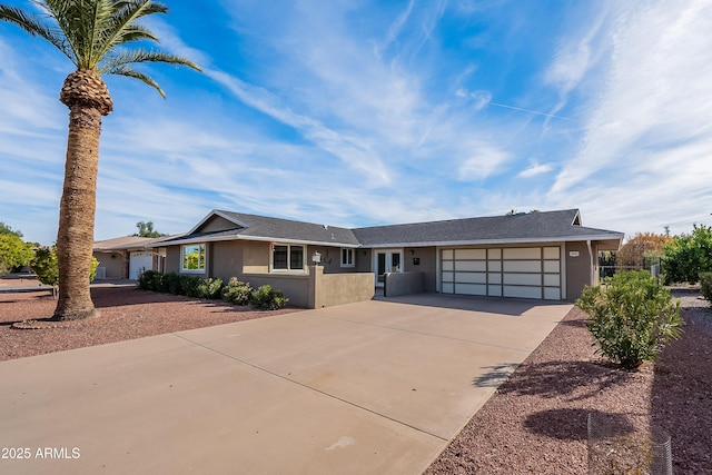 single story home with a garage