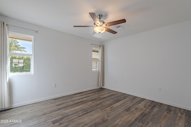 spare room featuring ceiling fan and hardwood / wood-style floors