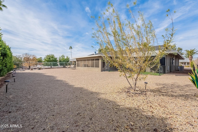 back of property featuring a sunroom