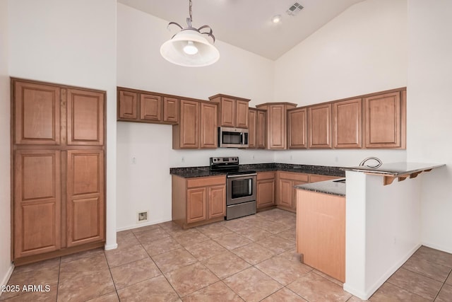 kitchen with high vaulted ceiling, brown cabinetry, stainless steel appliances, a peninsula, and visible vents