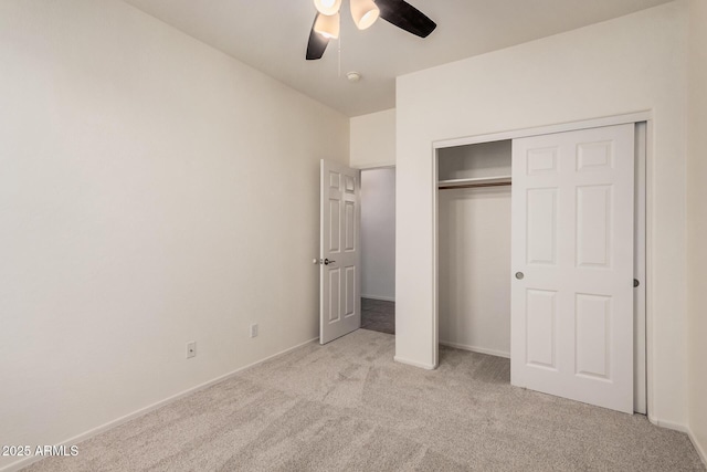 unfurnished bedroom featuring ceiling fan, baseboards, carpet flooring, and a closet