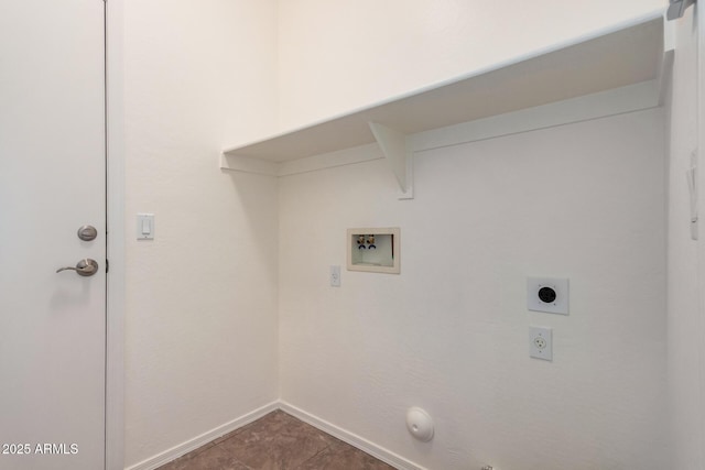 clothes washing area featuring hookup for an electric dryer, baseboards, washer hookup, gas dryer hookup, and laundry area