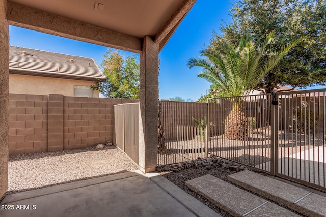 view of patio / terrace featuring fence