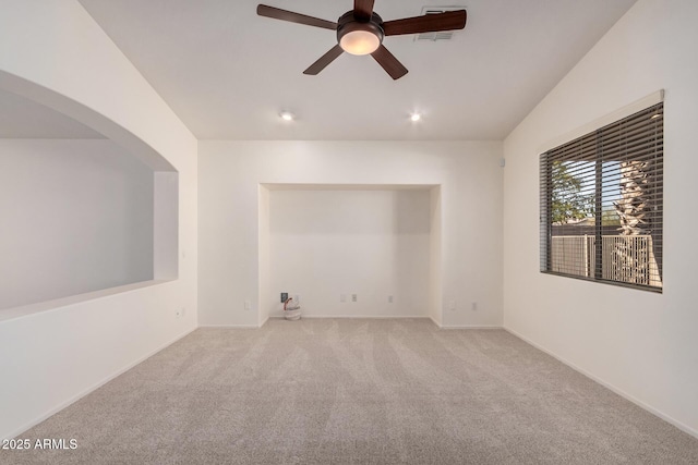 carpeted spare room featuring recessed lighting, visible vents, baseboards, and ceiling fan