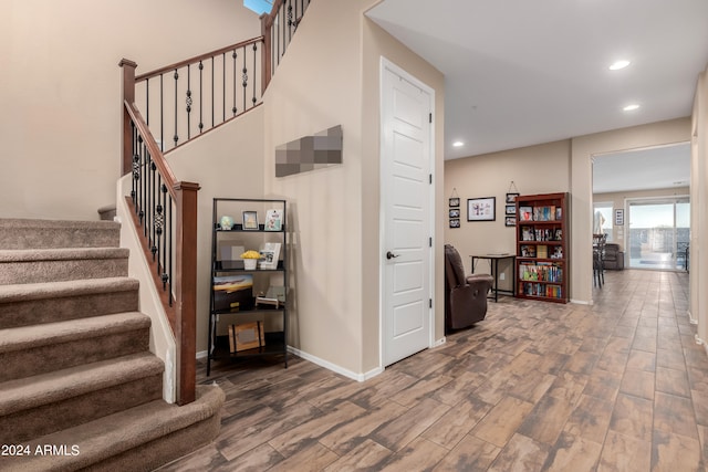 staircase featuring hardwood / wood-style flooring