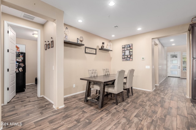 dining area with dark wood-type flooring