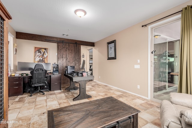 office featuring a barn door