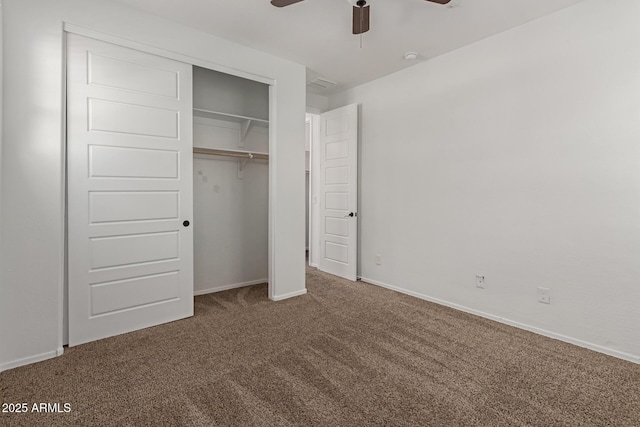 unfurnished bedroom featuring a ceiling fan, baseboards, a closet, and carpet floors