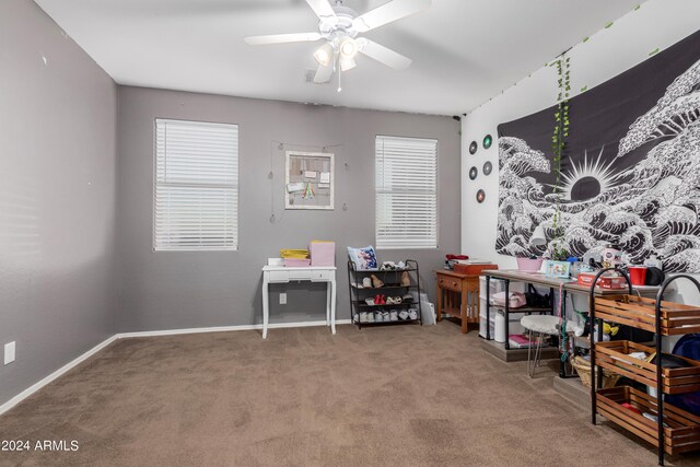 playroom featuring ceiling fan and carpet