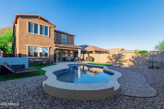 view of swimming pool with a patio area