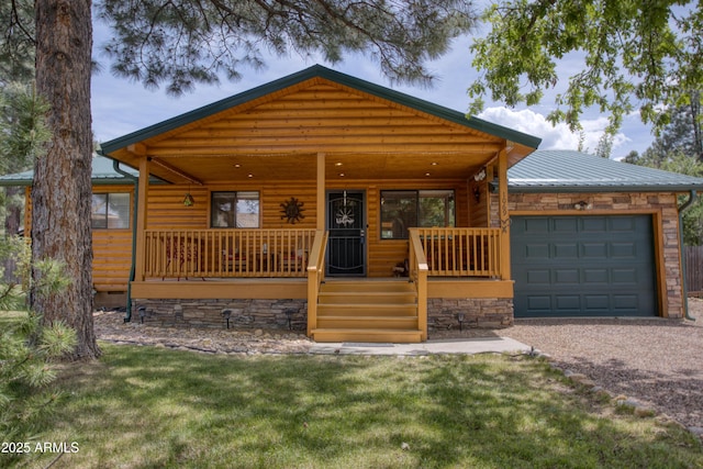 log-style house with a front yard, a garage, and a porch