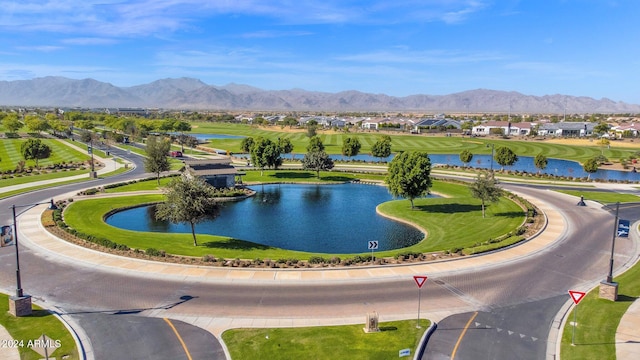 bird's eye view with a water and mountain view