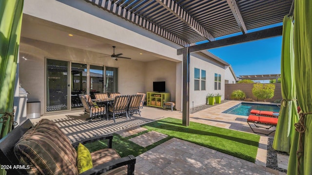 view of patio / terrace featuring a fenced in pool and ceiling fan