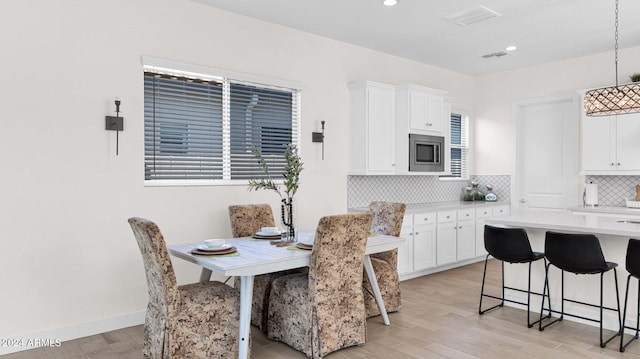 dining room featuring light hardwood / wood-style flooring