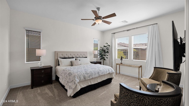 carpeted bedroom featuring ceiling fan