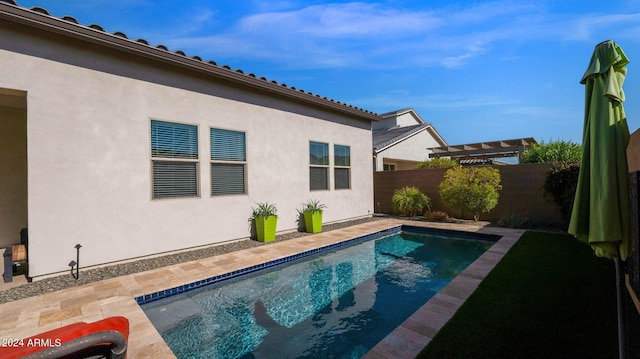 view of swimming pool featuring a patio