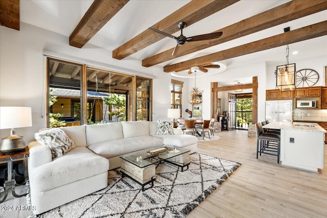 living room with recessed lighting, beamed ceiling, a ceiling fan, and light wood finished floors