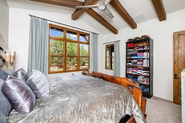 bedroom with visible vents, carpet flooring, and vaulted ceiling with beams
